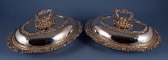 A pair of ornate Victorian oval silver plated entrée dishes with covers, length 278mm.